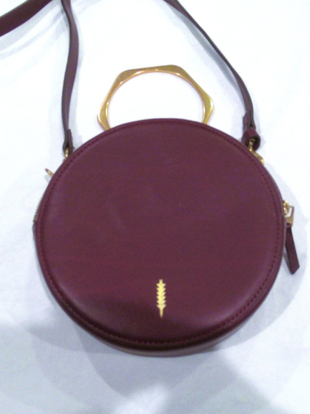 Thacker burgundy purse, both a crossbody and a bracelet handle